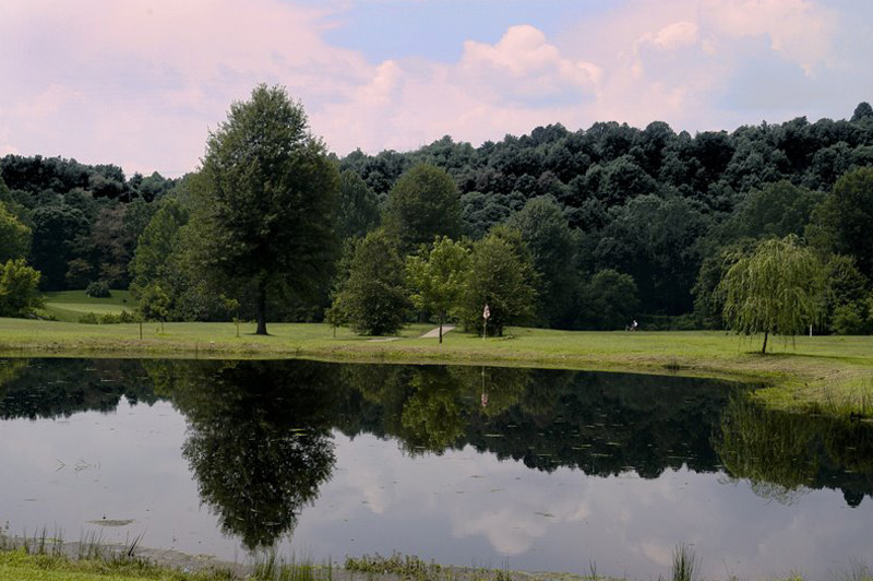 Pond on golf course at sunset